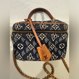 Louis Vuitton since 1854 vanity with chain